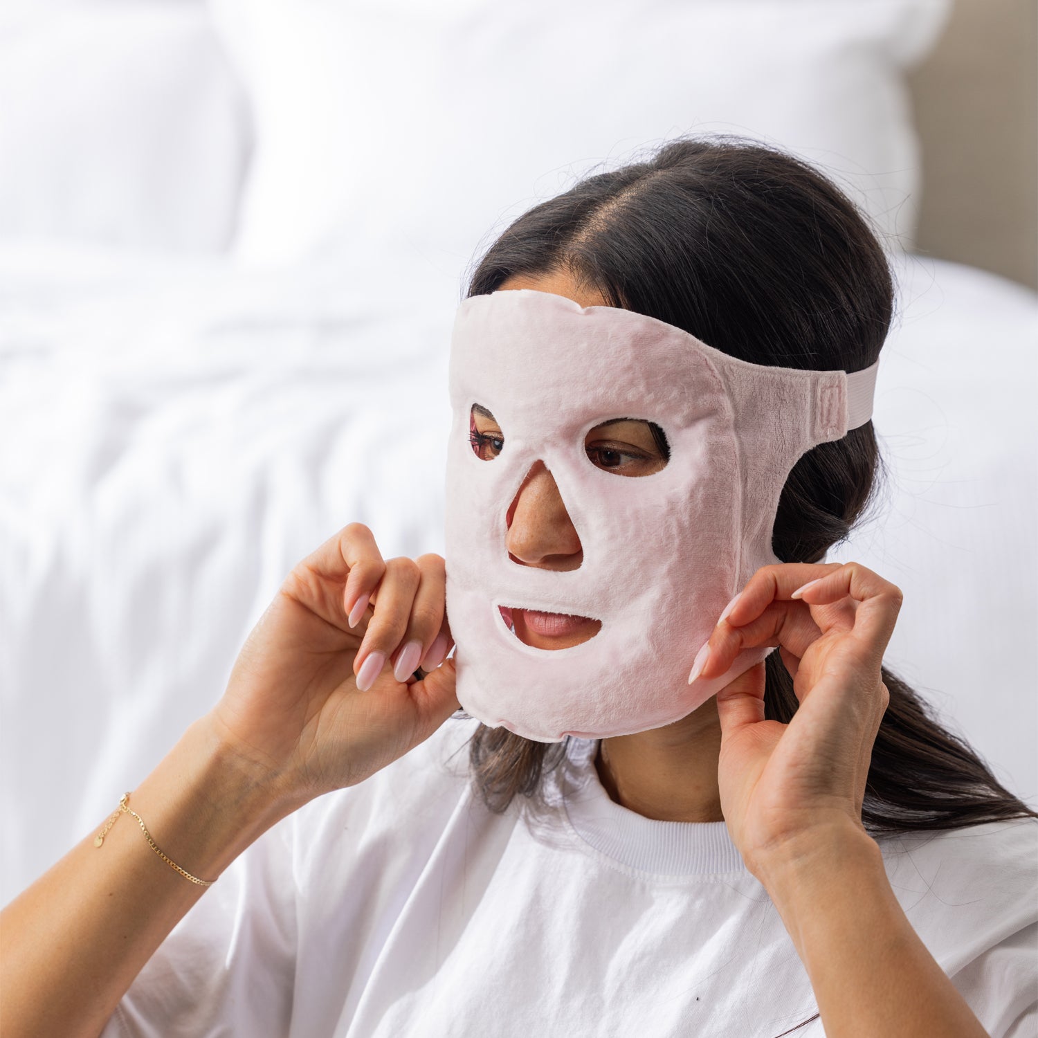 Grace & Gild Cooling Gel Bead Face Mask Light Pink being worn with adjustable head straps.