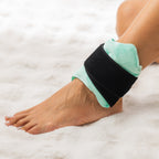 Grace & Gild Cooling Gel Bead Joint Wrap Light Green secured around the ankle with black adjustable strap.
