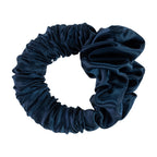 Grace & Gild Heatless Scrunchie Hair Curler in navy with a smooth satin-style finish and flexible circular design.