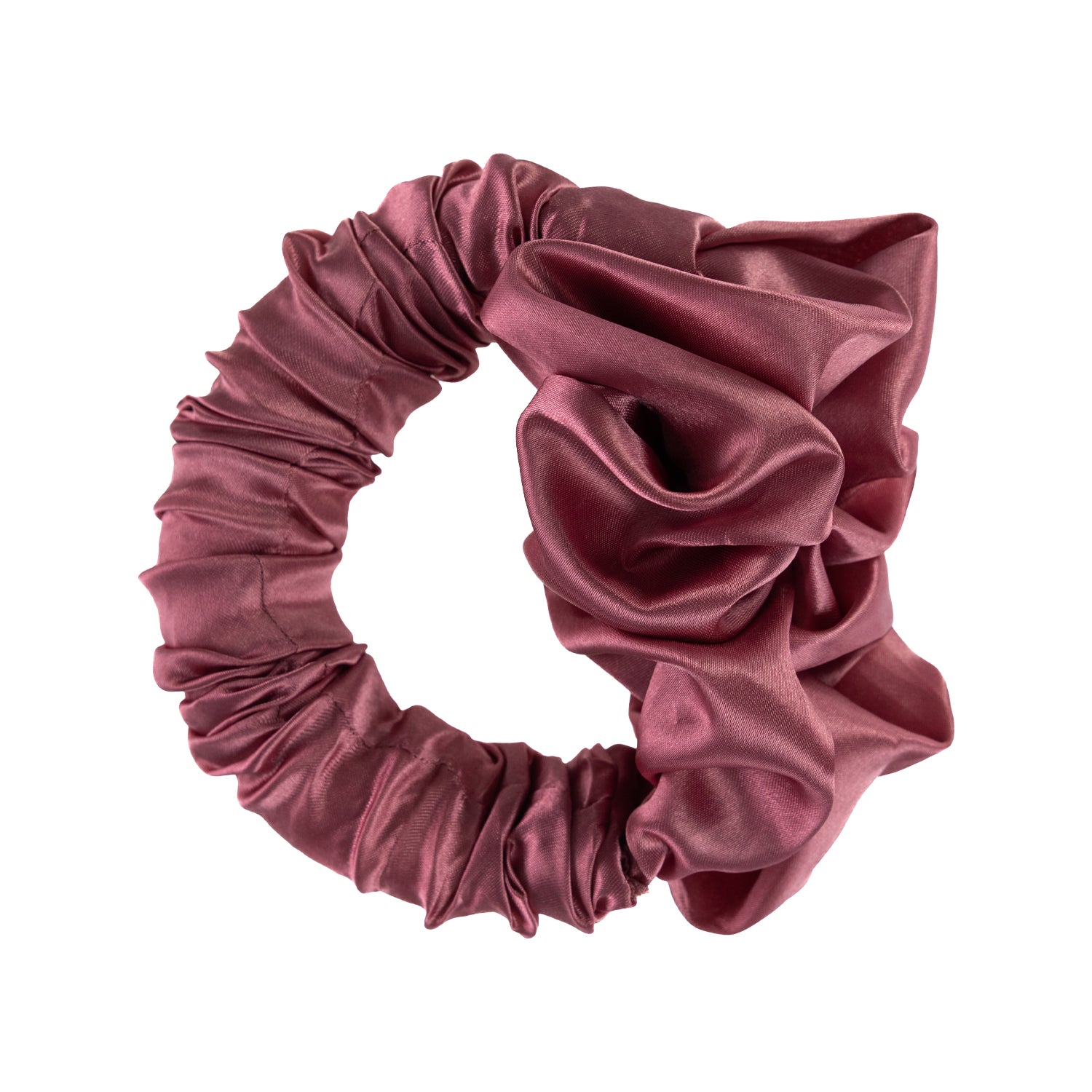 Grace & Gild Heatless Scrunchie Hair Curler in pink with a smooth satin-style finish and flexible circular design.