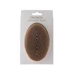 Grace & Gild Emmy Bath Brush in Natural, displayed in retail packaging with soft silicone bristles visible.