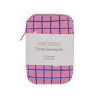 Grace & Gild travel sewing kit in a zippered pouch with a pink and blue plaid pattern, wrapped in a white paper label.