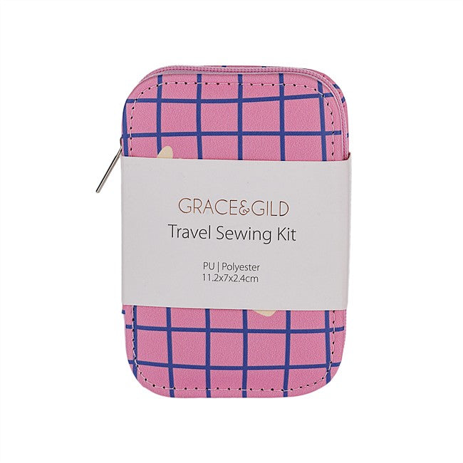 Grace & Gild travel sewing kit in a zippered pouch with a pink and blue plaid pattern, wrapped in a white paper label.