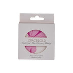 Grace & Gild Compact Mini Round Mirror in its original white cardboard packaging, featuring a pink and white striped mirror surface visible through a circular cutout.