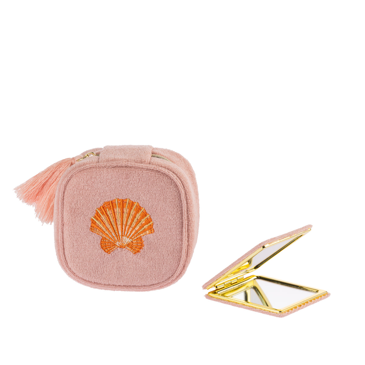 Blush pink scallop shell jewellery organiser displayed alongside a matching compact mirror, featuring gold-toned detailing and an embroidered shell design.