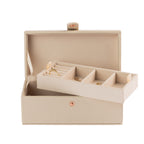 Open jewellery organiser featuring a removable upper tray with ring rolls, divided compartments, soft beige lining and additional storage space underneath.