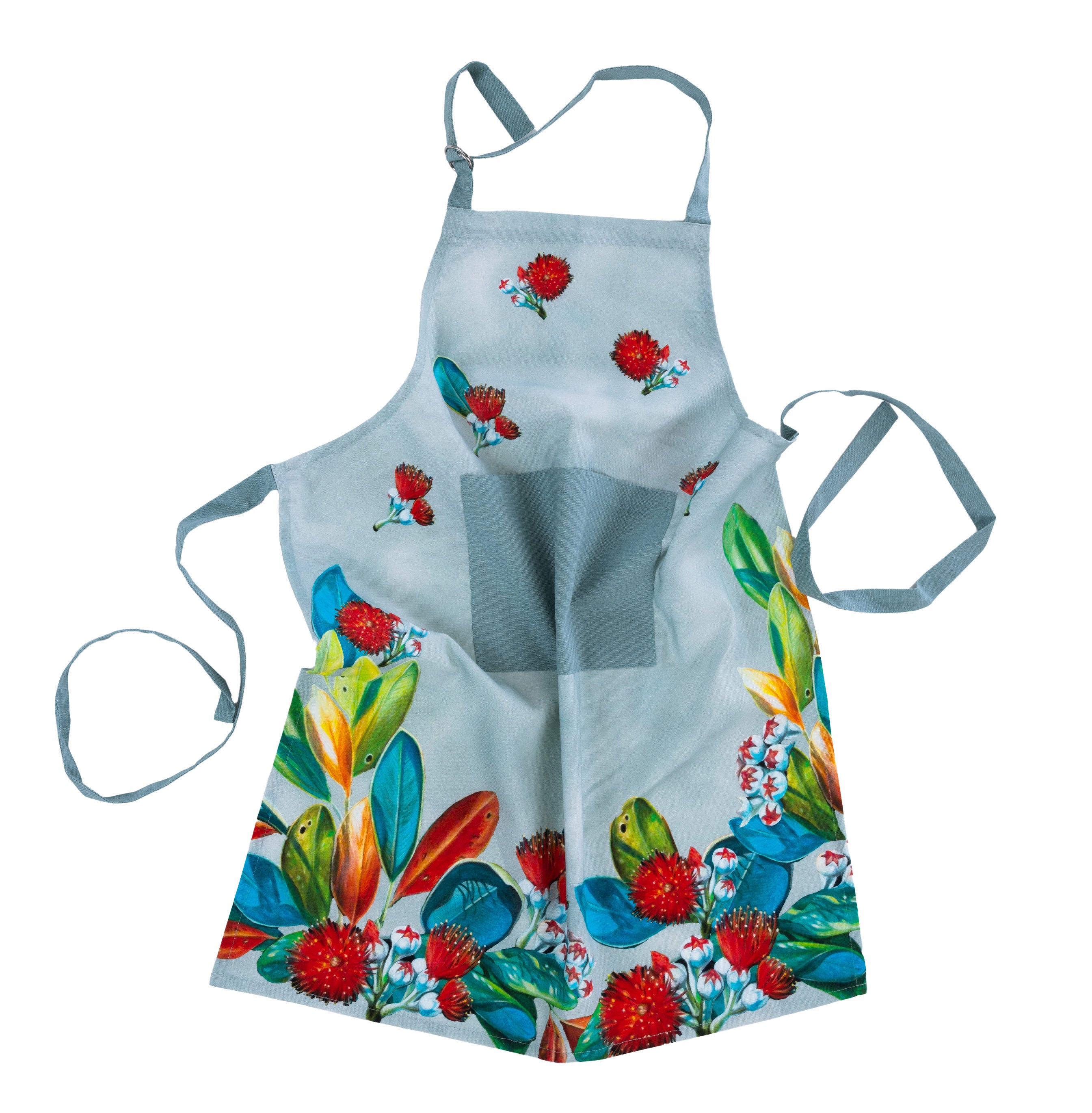 Design Plus Kiwiana Pohutukawa Apron in a soft sage colour featuring vibrant red pōhutukawa flowers and native foliage, complete with an adjustable neck strap and front pocket.