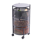 Black three-tier metal vegetable storage trolley filled with vegetables and fruit, featuring rotating mesh baskets and caster wheels.