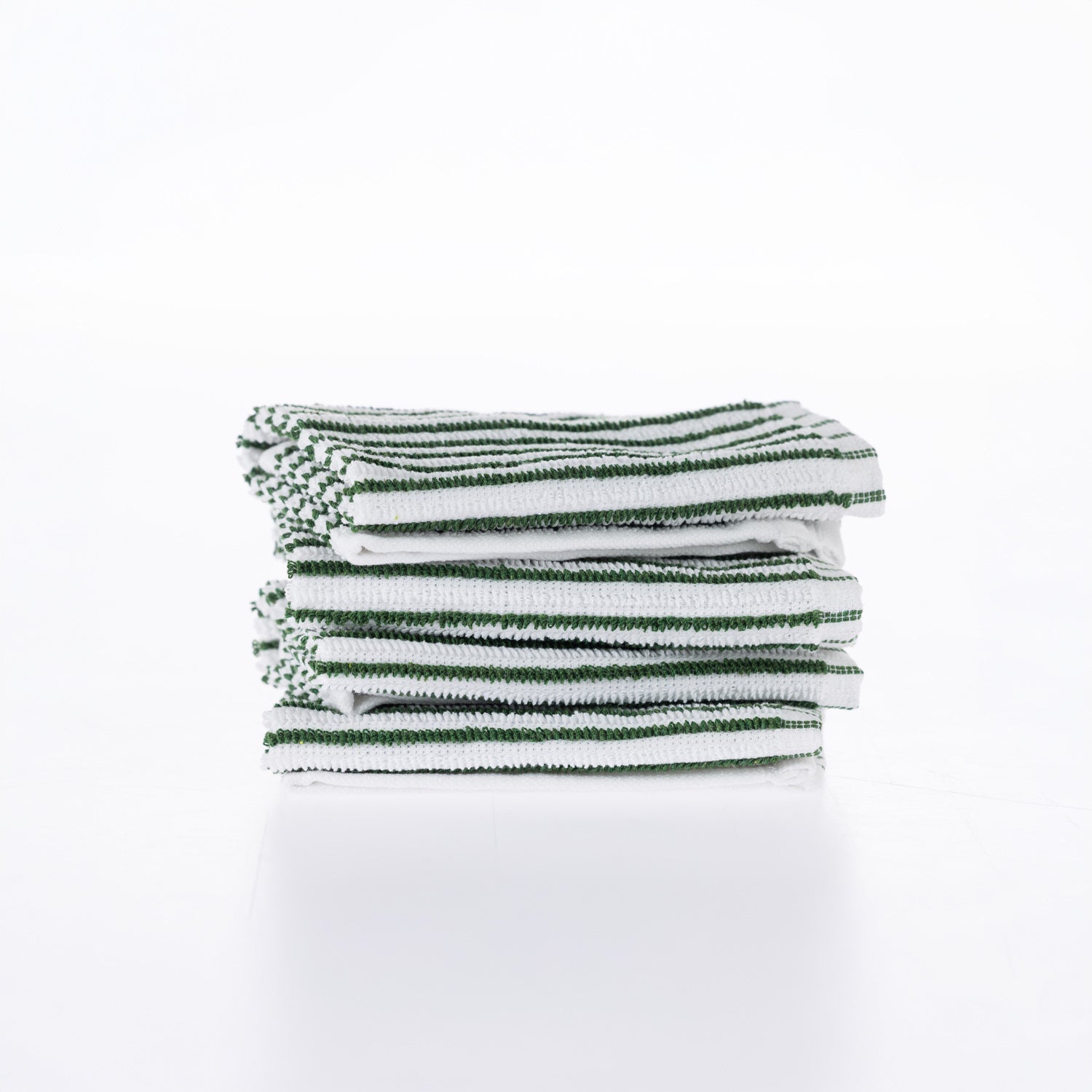 A neatly folded stack of white cotton dishcloths with fine green stripes is presented against a clean white background, highlighting their soft texture and classic design.