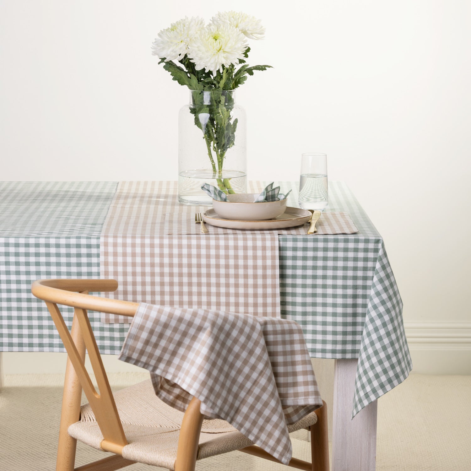 Gather Vichy Checks tableware range styled together on a dining table in Brown/Cream and Green/Ivory colourways.