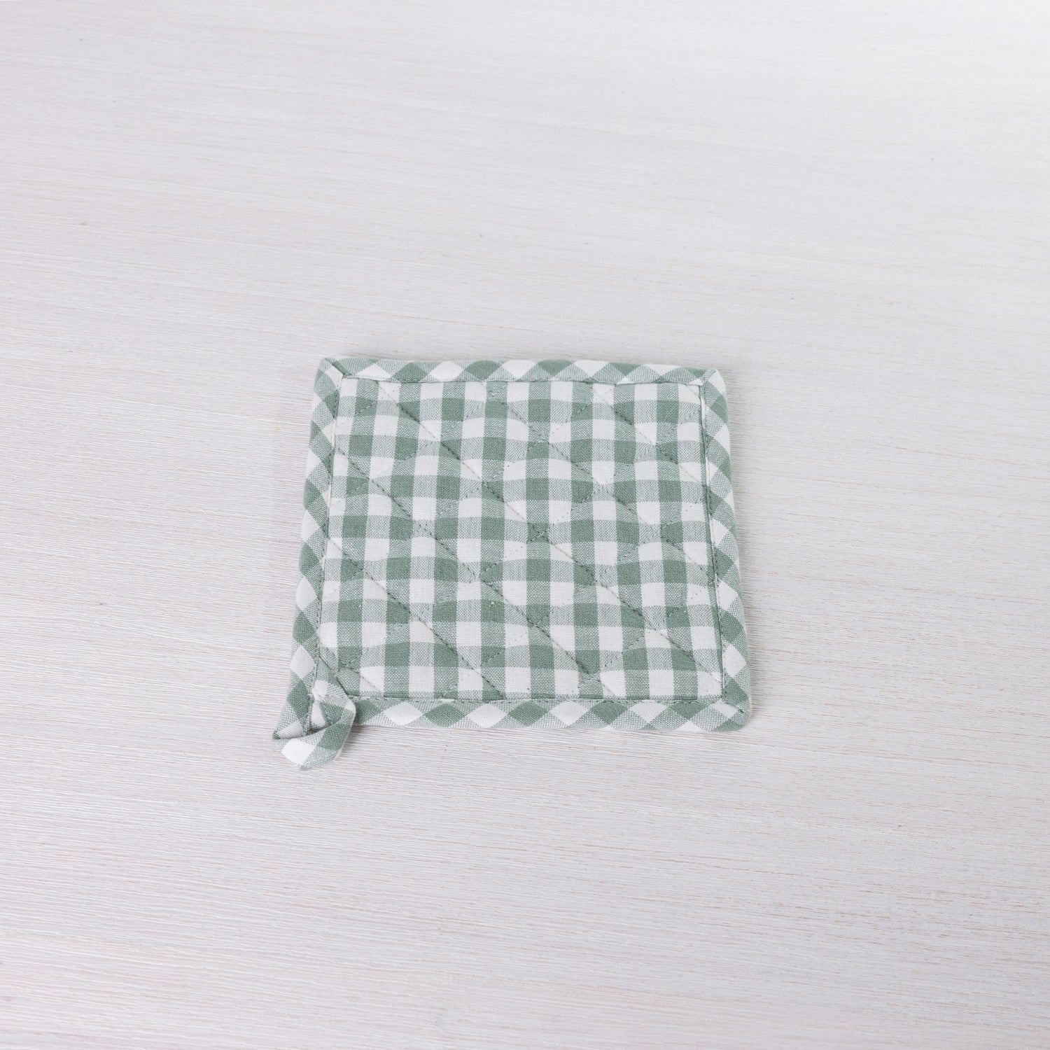 Gather Vichy Checks potholder in Green/Ivory with quilted stitching and a hanging loop.