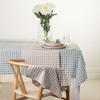 Gather Vichy Checks tableware range styled together on a dining table in Brown/Cream and Green/Ivory colourways.