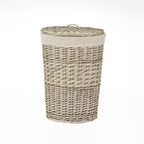 Small rectangular wicker laundry hamper with a woven lid, natural fabric lining, and natural wicker finish, displayed against a light grey background.