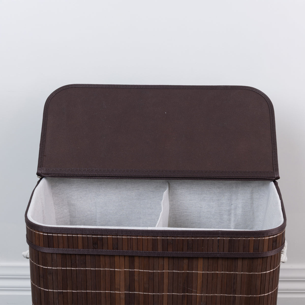 Design Republique Ranger Double Bamboo Hamper in Walnut, front close-up with the lid open, highlighting the two fabric-lined compartments and dark brown trim.