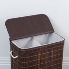 Design Republique Ranger Double Bamboo Hamper in Walnut, angled view with the lid open to reveal two separate fabric-lined compartments for sorting laundry.