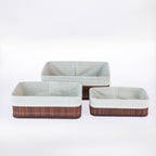 Home Co. Aston 3 Piece Bamboo Baskets in Brown, featuring three rectangular baskets in varying sizes with dark brown bamboo slats, matching trim and light fabric linings, displayed together on a white background.