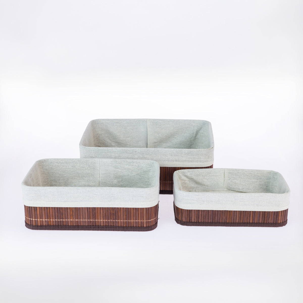 Home Co. Aston 3 Piece Bamboo Baskets in Brown, featuring three rectangular baskets in varying sizes with dark brown bamboo slats, matching trim and light fabric linings, displayed together on a white background.