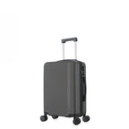 bb&b Travel Menton Suitcase in graphite, shown from a side angle with textured hard-shell exterior, spinner wheels, and an extended handle.