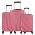 Three raspberry hard-shell suitcases in Small, Medium and Large sizes, featuring diagonal ribbed detailing, telescopic handles and spinner wheels.
