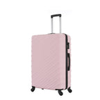 Angled view of the Medium Pink Blush hard-shell suitcase showing the ribbed shell, zip closure, side carry handle and spinner wheels.
