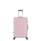 Front view of the Small Pink Blush hard-shell suitcase with diagonal ribbed detailing, telescopic handle and spinner wheels.