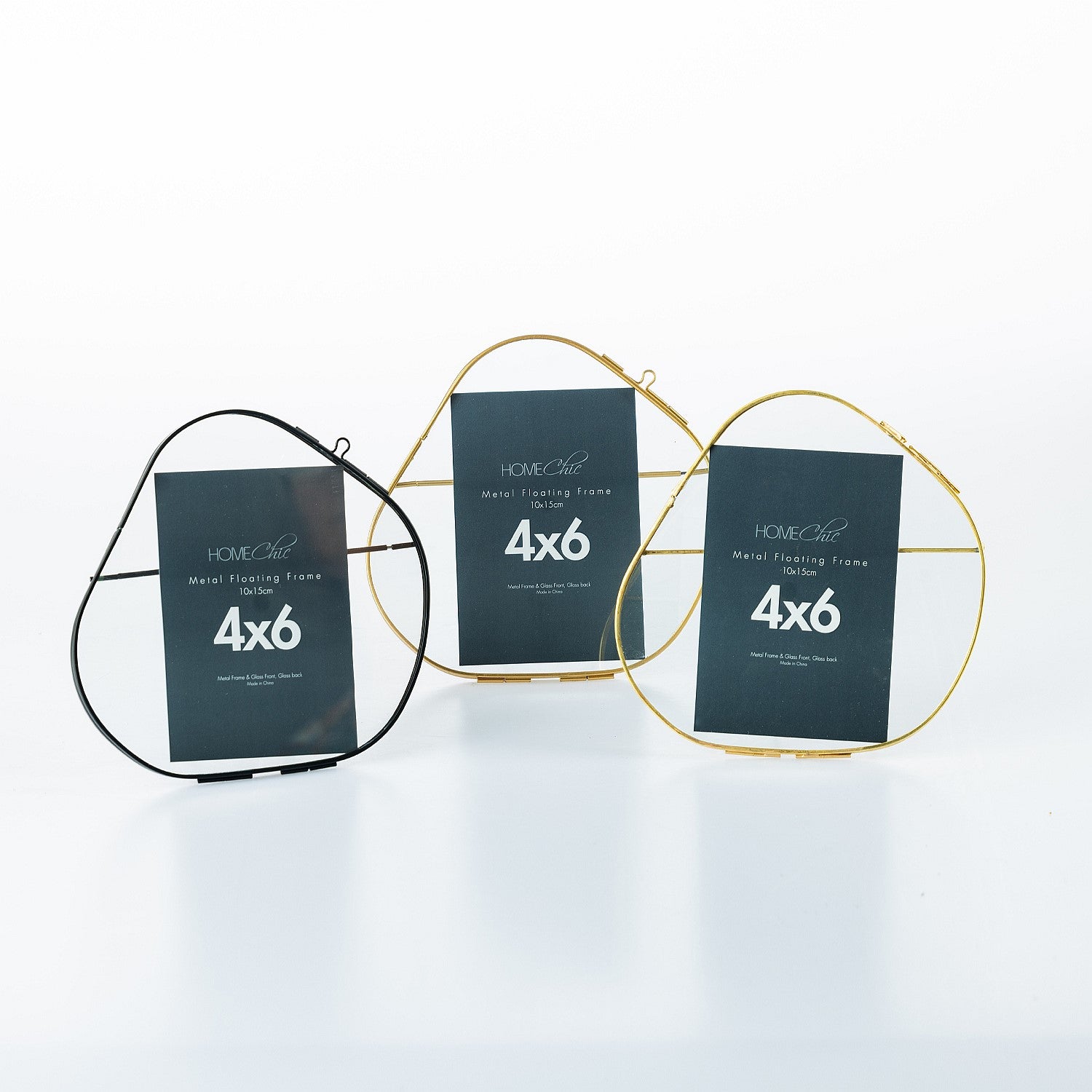 Three metal photo frames with '4x6' labels on a white background