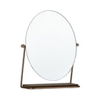 Gold tabletop vanity mirror with an oval frameless design, tilting stand, and integrated storage tray.
