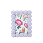 Lilac bobble-style photo frame with rounded bead detailing around the border and a colourful floral print displayed inside, shown on a white background.