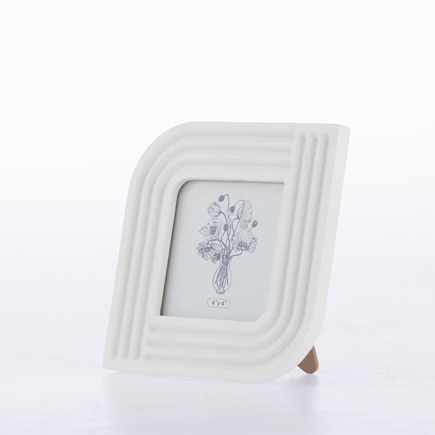 A white ceramic picture frame with a rounded, ribbed border and a small wooden stand, featuring a blue line-art illustration of a flower bouquet on the insert.