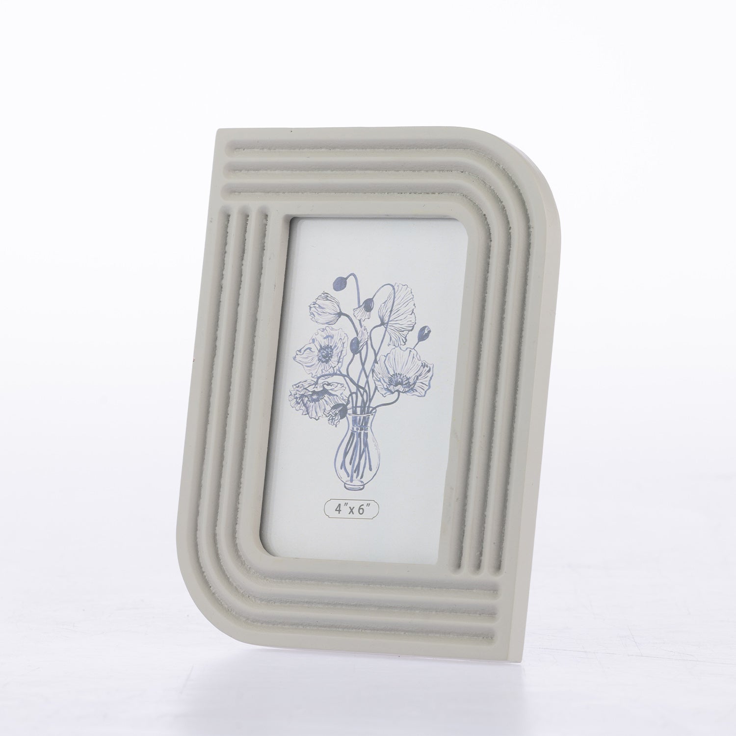 A light gray rectangular picture frame with rounded top corners and horizontal ridged detailing, holding a white insert with a blue floral illustration. The frame is photographed on a clean white background.