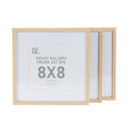 A set of three natural 8×8-inch gallery-style picture frames is displayed overlapping against a plain light background, with the front frame showing a product insert.