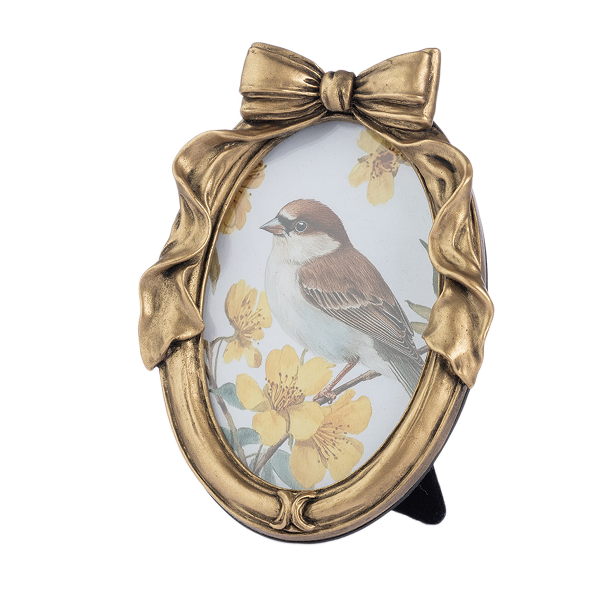 An oval decorative picture frame with a sculpted gold-tone bow at the top and a bird perched among yellow flowers on the insert, shown against a plain white background.