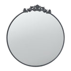Design Republique Ember Large Round Black Mirror with an ornate decorative crest and slim black frame, shown against a white background.