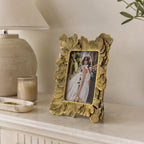 Design Republique Duchess Large Gold Photo Frame styled on a console table with a ceramic lamp, candle and decorative accents in a warm, elegant interior setting.