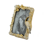 Design Republique Flamingo Small Gold Photo Frame with an ornate gold branch frame featuring floral details and a perched flamingo, displayed against a white background.