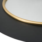 Close-up of the Design Plus Leona LED Mirror showing the gold inner trim, reflective mirror surface and matte black outer frame.