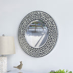 Design Republique Algaia round wall mirror displayed on a white wall, featuring a grey and white geometric mosaic-style frame.