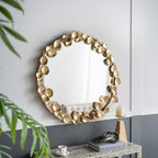 Gracious Living Gold Leaf Mirror displayed above a console table in a contemporary interior setting with decorative accessories and greenery.