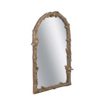 Angled view of the Gracious Living Birds Arched Mirror showing the textured gold branch frame and bird accents.