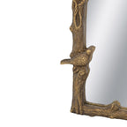 Close-up of the Gracious Living Birds Arched Mirror highlighting a sculpted bird perched on the detailed branch-style frame.