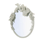 Angled view of the Gracious Living Birds & Flowers Round Mirror highlighting its layered white floral and bird embellishments.