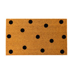 A classic natural coir doormat features a playful black polka dot design, adding a simple yet stylish touch to any entryway.