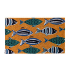 A vibrant coir doormat featuring playful blue and teal fish adds a cheerful coastal-inspired touch to a bright, welcoming entryway.