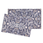 Two rectangular mats with a detailed botanical floral pattern in navy blue, cream, and beige, displayed overlapping on a solid white background.