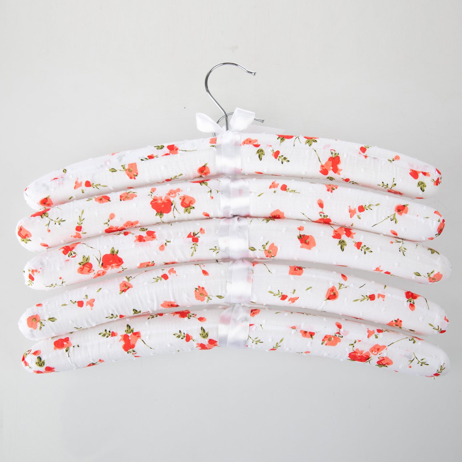 Home Essentials Padded Hangers 5 Pack Bunch O’ Flowers Pink featuring white padded hangers with a pink floral print and ribbon details.
