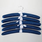 Home Essentials Padded Hangers 5 Pack Blue Spots Navy featuring navy padded hangers with a white spot print and ribbon details.