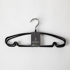 A set of five black metal clothes hangers with a silver-colored hook, shown with a gray paper label that reads '5 hangers' on a plain white background.