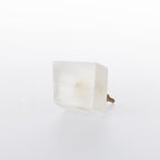 White square stone drawer knob with a natural translucent finish and gold-tone metal fitting.