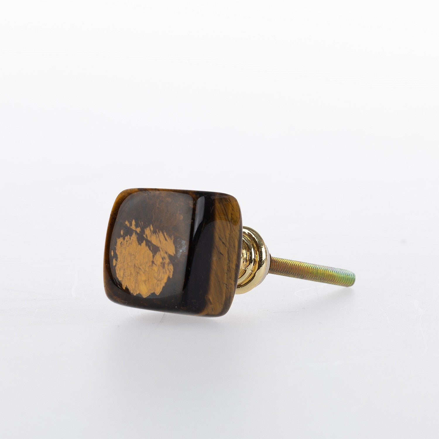 Brown tiger's eye stone drawer knob with polished natural finish and gold-tone metal fitting.
