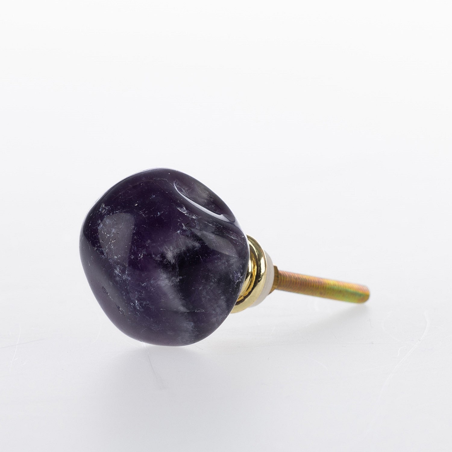 Amethyst gemstone drawer knob with polished natural stone finish and gold-tone metal fitting.
